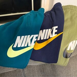 3 pairs of Nike Sweatpants. Boys size XL 18/20. Green pair has small ink stain.